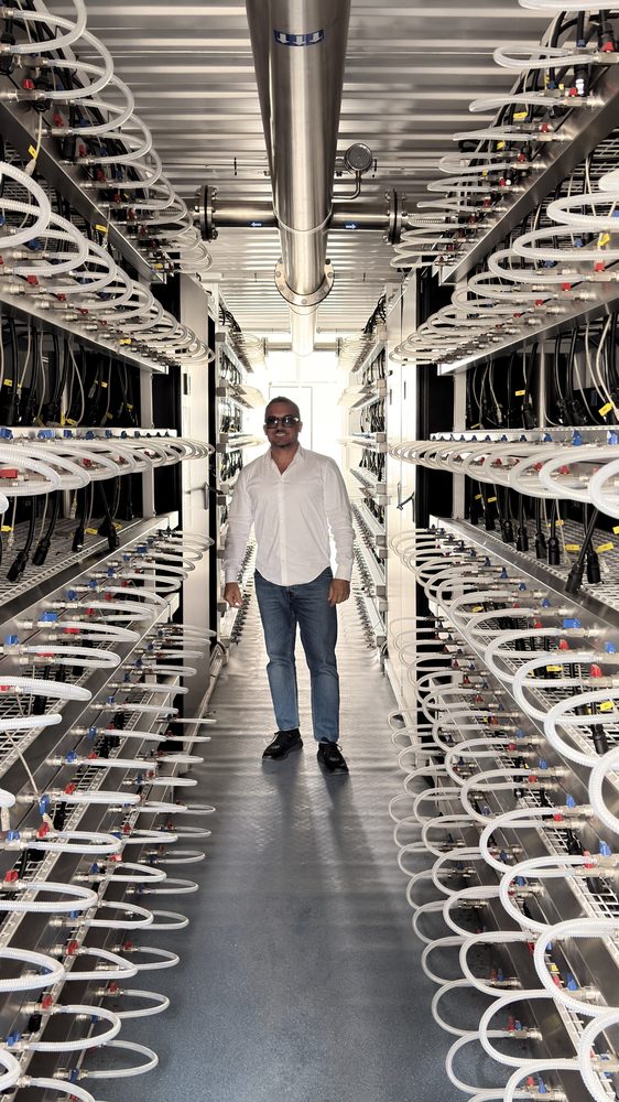 NOESIS CEO inside an ASIC data hall at a manufacturing partner in China